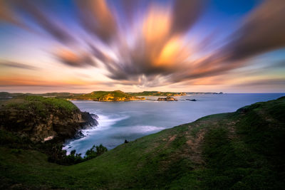 Scenic view of sea against sky at sunset