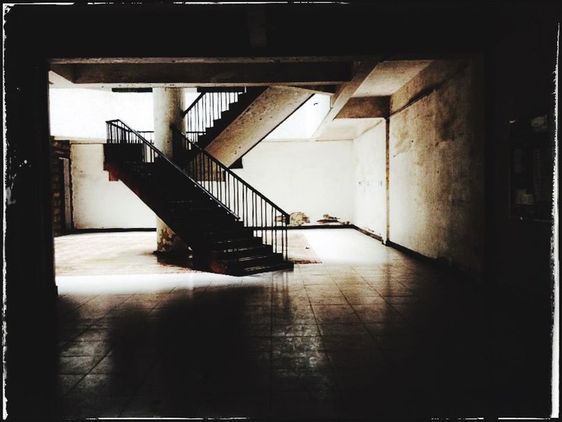 indoors, transfer print, architecture, built structure, empty, railing, absence, flooring, auto post production filter, steps, staircase, the way forward, chair, steps and staircases, no people, sunlight, tiled floor, corridor, ceiling, high angle view