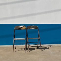 Empty chairs on beach