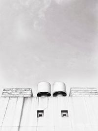 Low angle view of factory building against sky