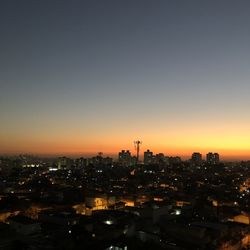 High angle view of illuminated buildings against sky during sunset