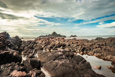 Panoramic view of rock formations against sky