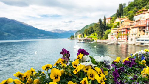 Scenic view of sea and mountains against sky