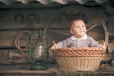 Portrait of cute boy in basket