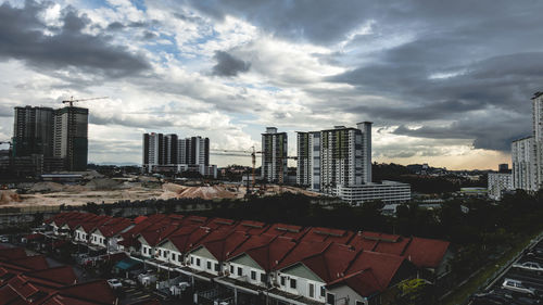 High angle view of buildings in city against sky