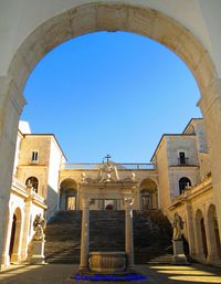 Low angle view of historic building against clear blue sky