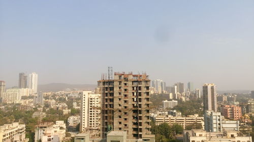 Scenic view of cityscape against sky