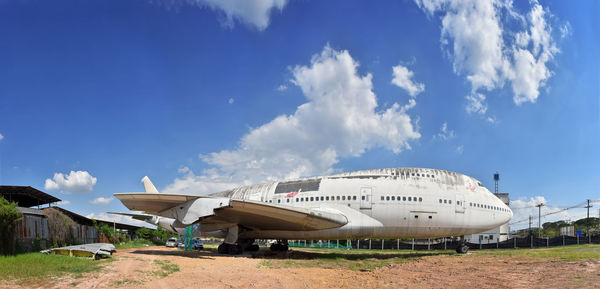 Panoramic view of airport and building against sky