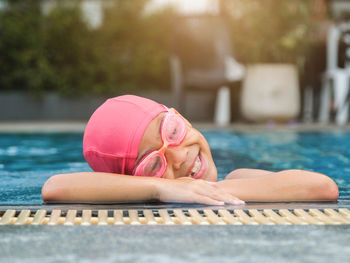 Low section of woman exercising in gym