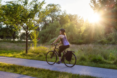 Man riding bicycle on road