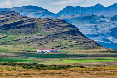 Scenic view of landscape and mountains against sky