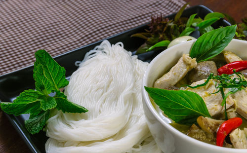 High angle view of rice vermicelli with meat in bowl