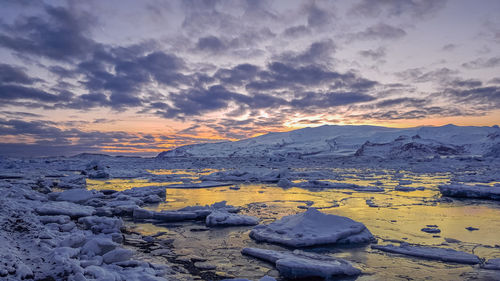 Scenic view of jökulsarión glacier at sunset