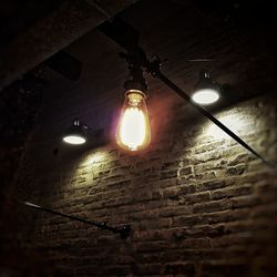 Low angle view of illuminated light bulb