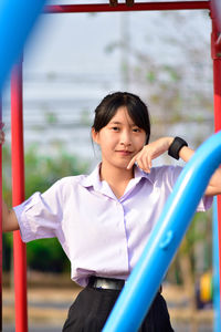 Portrait of young woman outdoors