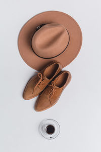 High angle view of shoes on table against white background