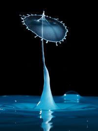 Close-up of water splashing on black background