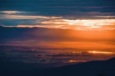 Scenic view of dramatic sky during sunset