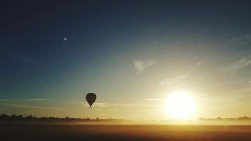 Hot air balloon against sky at sunset