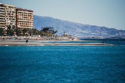 Scenic view of calm sea against blue sky