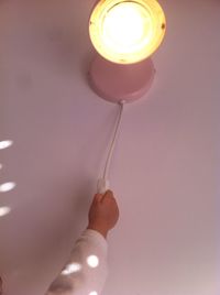 Light bulb hanging from ceiling