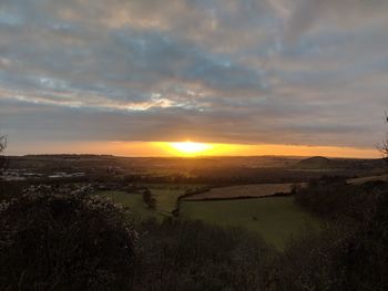 Scenic view of landscape against sky during sunset