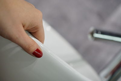 Close-up of person holding cigarette