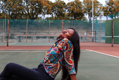 Side view of a young woman with eyes closed
