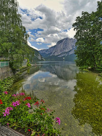 Scenic view of lake and mountains against sky