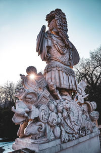 Low angle view of statue against sky