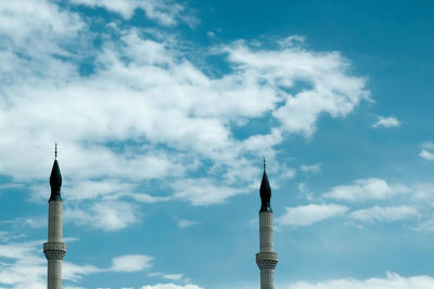 Low angle view of bell tower against sky