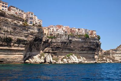 Low angle view of castle on cliff