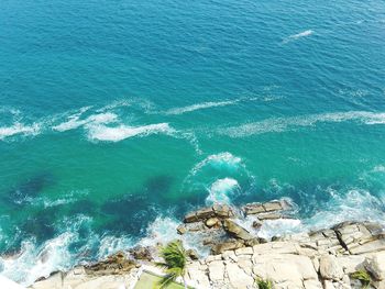 High angle view of rock on sea shore