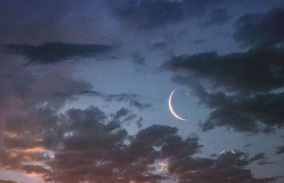 Low angle view of moon against sky at night