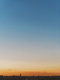 Scenic view of silhouette landscape against clear sky during sunset