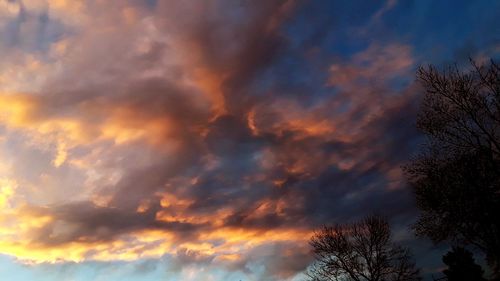 Low angle view of dramatic sky during sunset