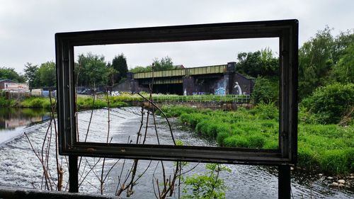 Built structure with trees in foreground