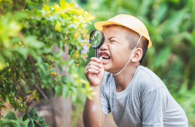 Portrait of mid adult man holding plants