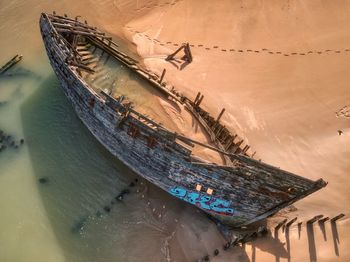 High angle view of abandoned boat on beach