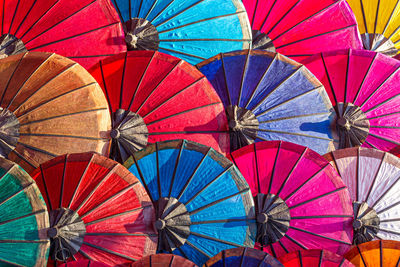 Close-up of multi colored umbrellas for sale in market