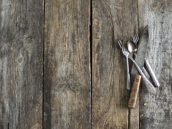 Directly above shot of kitchen utensils on old wooden table