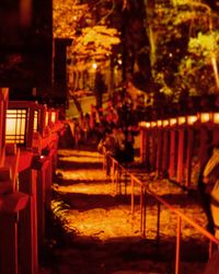 Close-up of chairs and tables at night