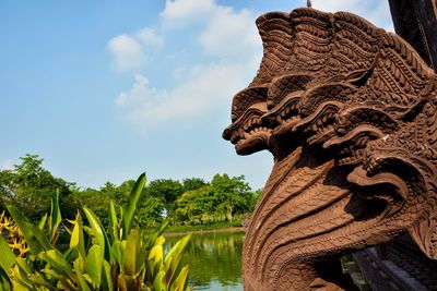 Low angle view of statue against sky