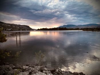 Scenic view of lake against sky during sunset