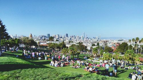 A view of downtown san francisco's skyline from the top of dolores park in the mission district