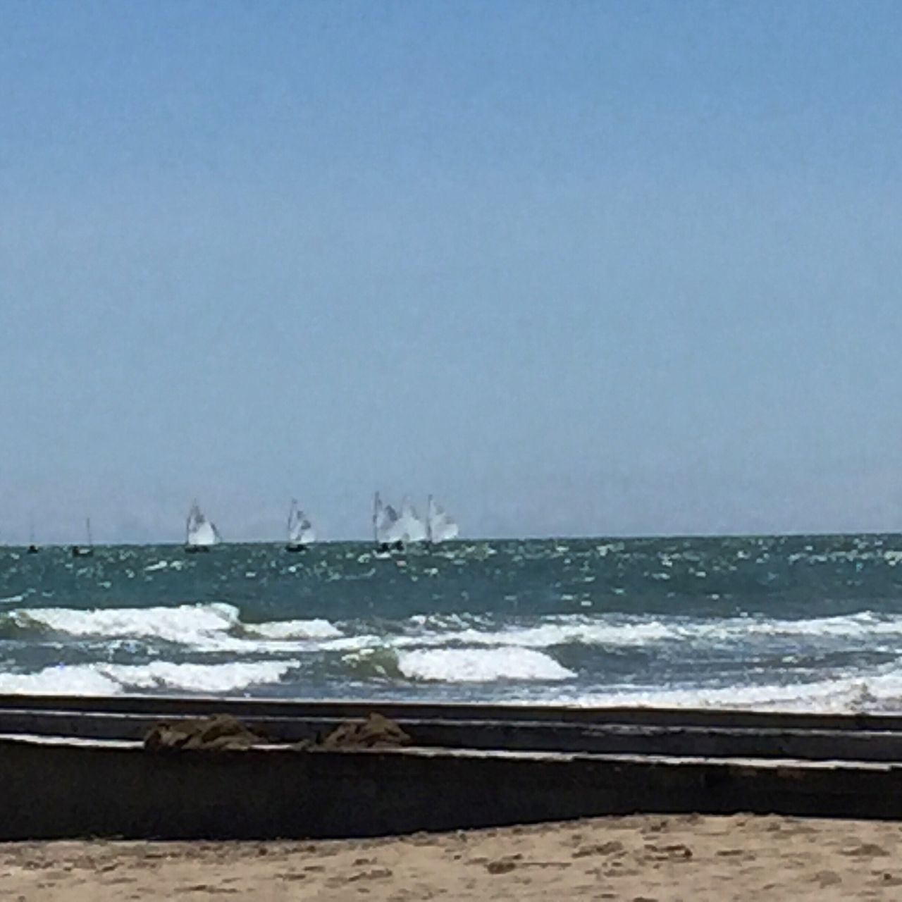 sea, water, clear sky, copy space, horizon over water, nautical vessel, blue, tranquil scene, nature, tranquility, transportation, scenics, beauty in nature, day, mode of transport, boat, no people, outdoors, sky, beach