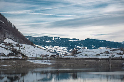 Scenic view of snowcapped mountains against sky