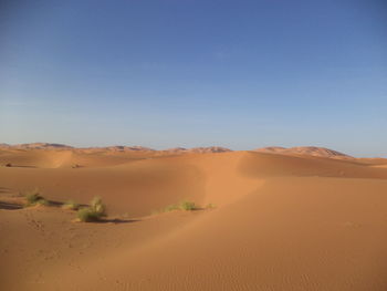 Scenic view of desert against clear sky