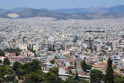 High angle view of townscape and mountains