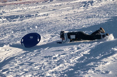 View of people skiing on snowcapped mountain